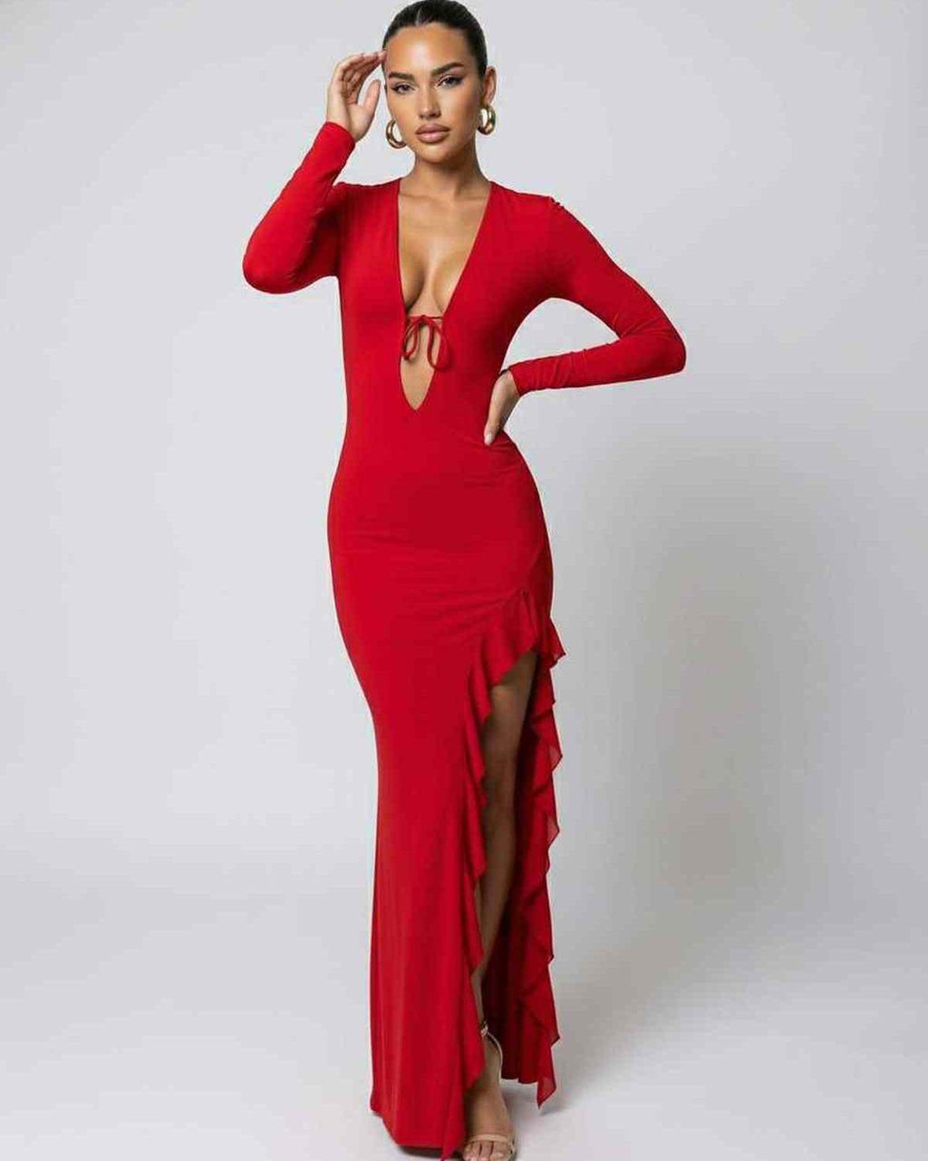 Valencia Maxi Dress featuring a deep V-neck, ruffle slit detail, and long sleeves by Lauven in vibrant red.
