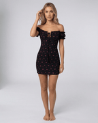 Valencia Mini Dress by Lauven - Black floral off shoulder mini dress with fitted silhouette and short sleeves.