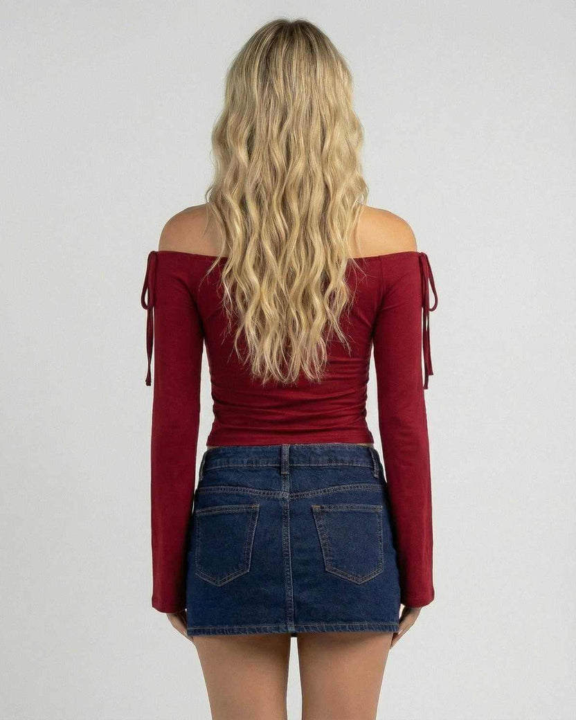 Back view of a woman wearing the Valencia Top by Lauven, an off-the-shoulder slim fit top in deep burgundy.