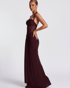 Valora Maxi Dress in burgundy with a halter design, mesh panel, and mermaid silhouette by Lauven.