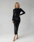 Vega Midi Dress by Lauven showcasing a model in a sleek black velvet long sleeve design.