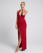 Red maxi dress by Lauven featuring a deep V-neck, sleeveless halter cut, and flattering high waist for elegant occasions.