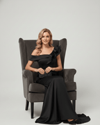 Velmora Maxi Dress in black featuring off-shoulder neckline, asymmetrical ruffle detail, by Lauven.