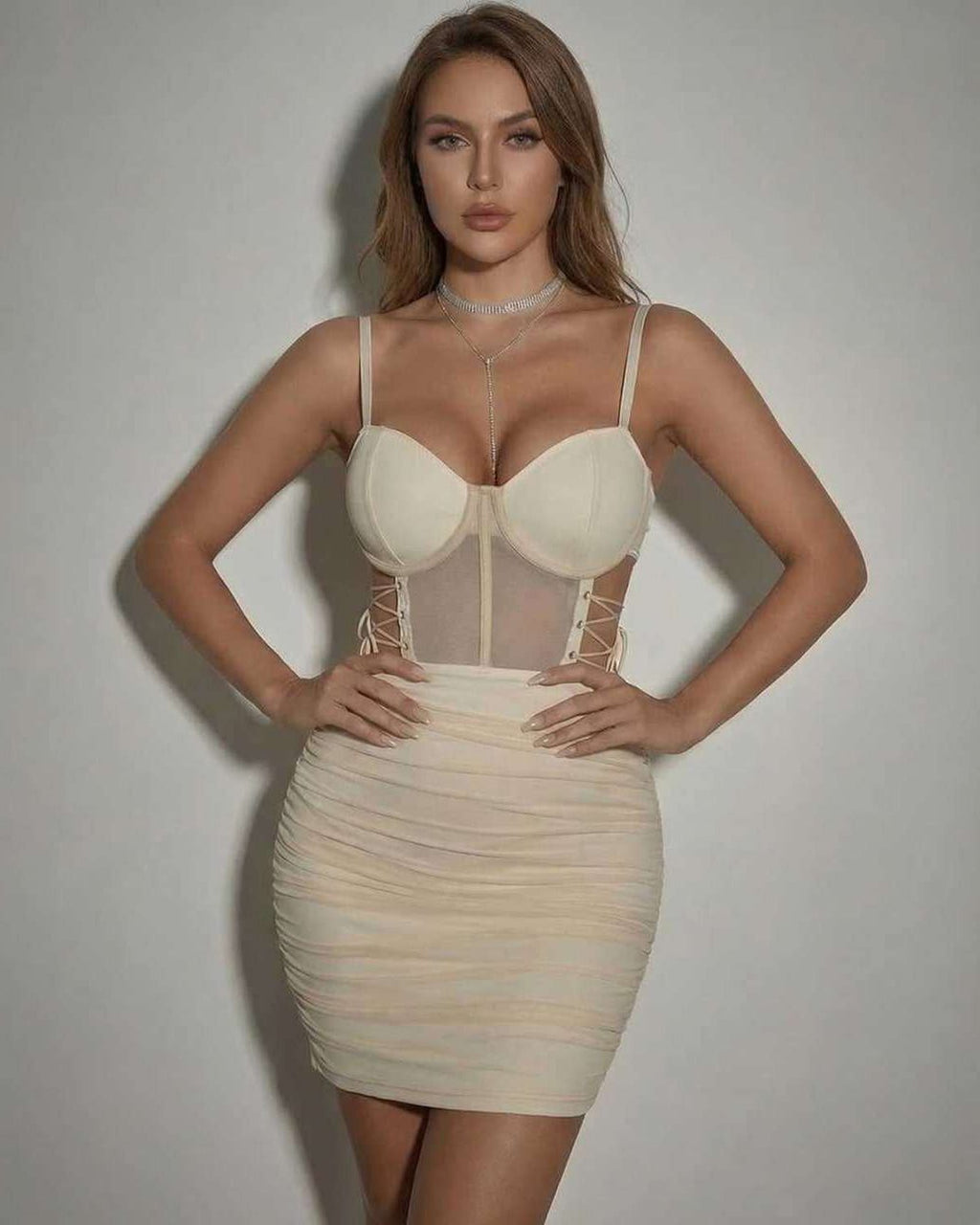 Lauven Venice Mini Dress in beige with sheer panel and fitted pencil silhouette.