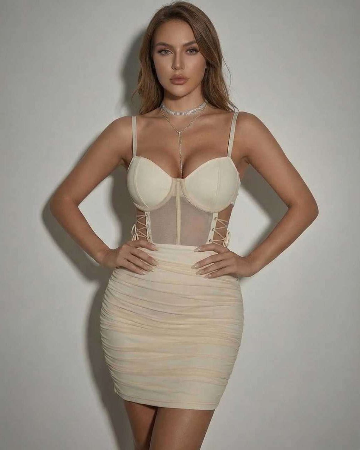 Lauven Venice Mini Dress in beige with sheer panel and fitted pencil silhouette.