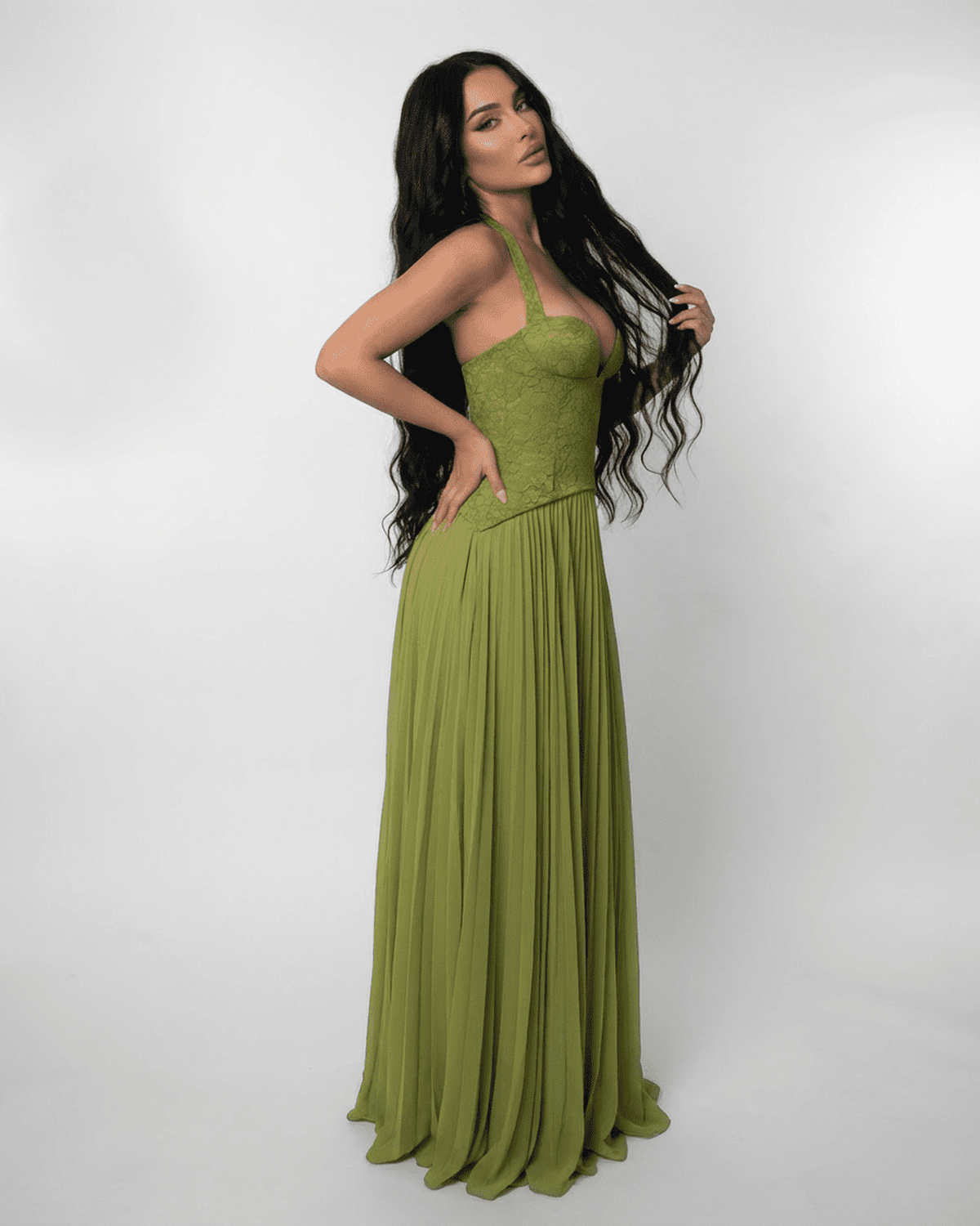 Lauven Verdant Maxi Dress featuring a lace bodice and pleated olive green skirt, ideal for elegant occasions.