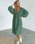 Verona Midi Dress - Green Cotton Midi Dress with Puff Sleeves by Lauven, showcasing modern elegance and comfort.