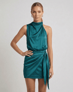 Verona Mini Dress by Lauven, emerald satin mini dress featuring a draped high neck and wrap tie detail.