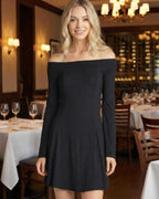 Verona Mini Dress by Lauven - Off-Shoulder Long Sleeve A-Line Black Mini Dress in a dining setting.