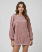 Women wearing a soft ribbed Verona Sweater by Lauven in dusty rose color, showcasing an oversized long sleeve design.