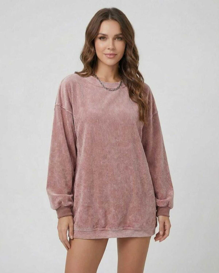 Women wearing a soft ribbed Verona Sweater by Lauven in dusty rose color, showcasing an oversized long sleeve design.