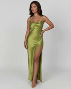 Vesper Maxi Dress by Lauven in bold olive green satin with asymmetrical silhouette and thigh-high slit.