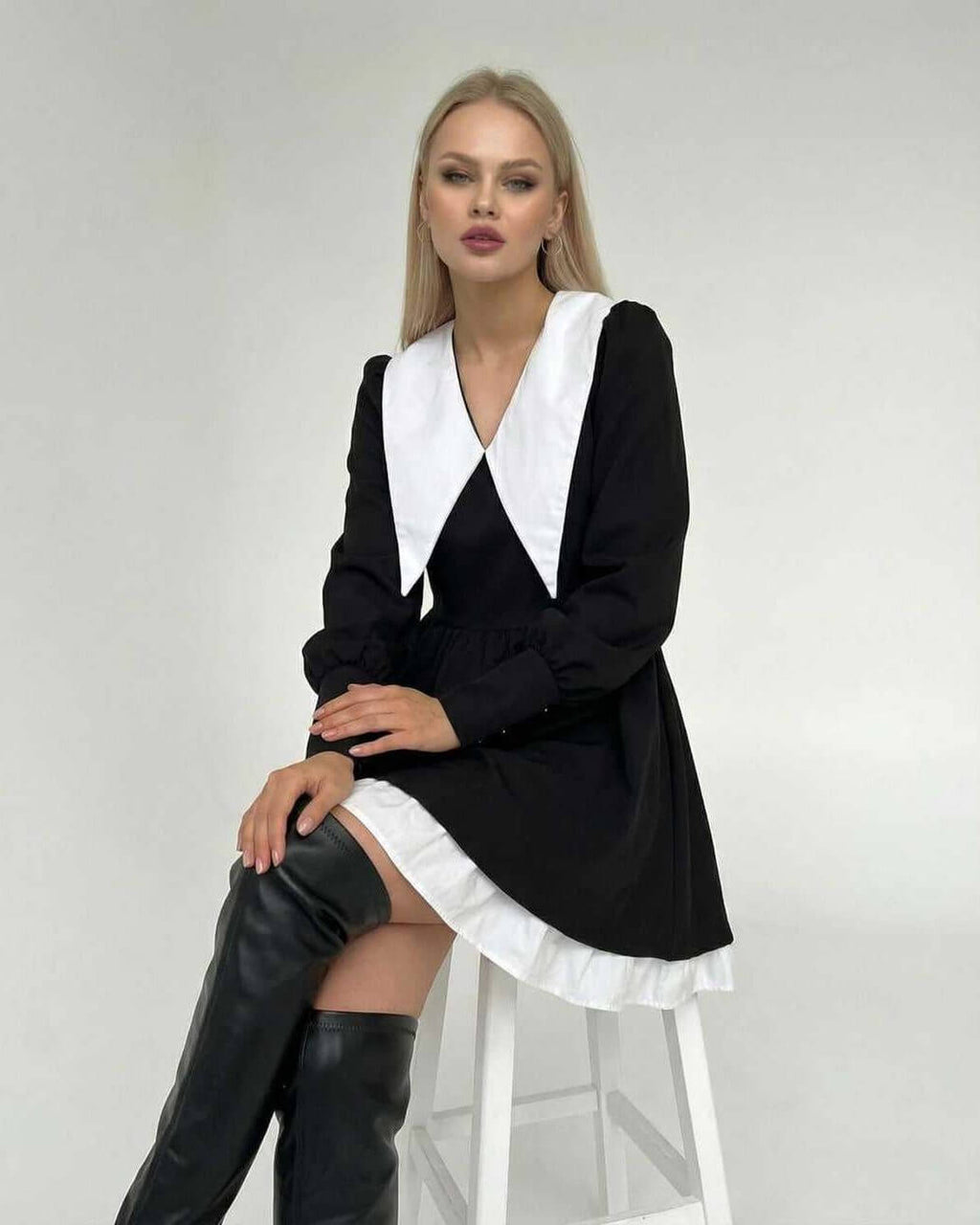 Vesper Mini Dress by Lauven featuring chic black and white patchwork design and distinctive lapel collar.