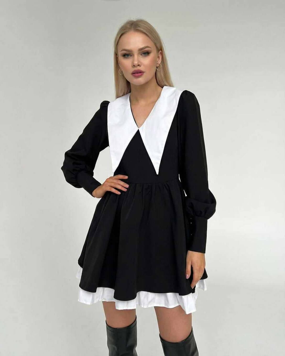Vesper Mini Dress by Lauven featuring chic black and white patchwork, lapel collar, and flowing skirt.