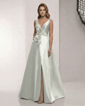 Virelle Maxi Dress in sage silver satin, featuring a V-neck, bow detail, and A-line silhouette by Lauven.