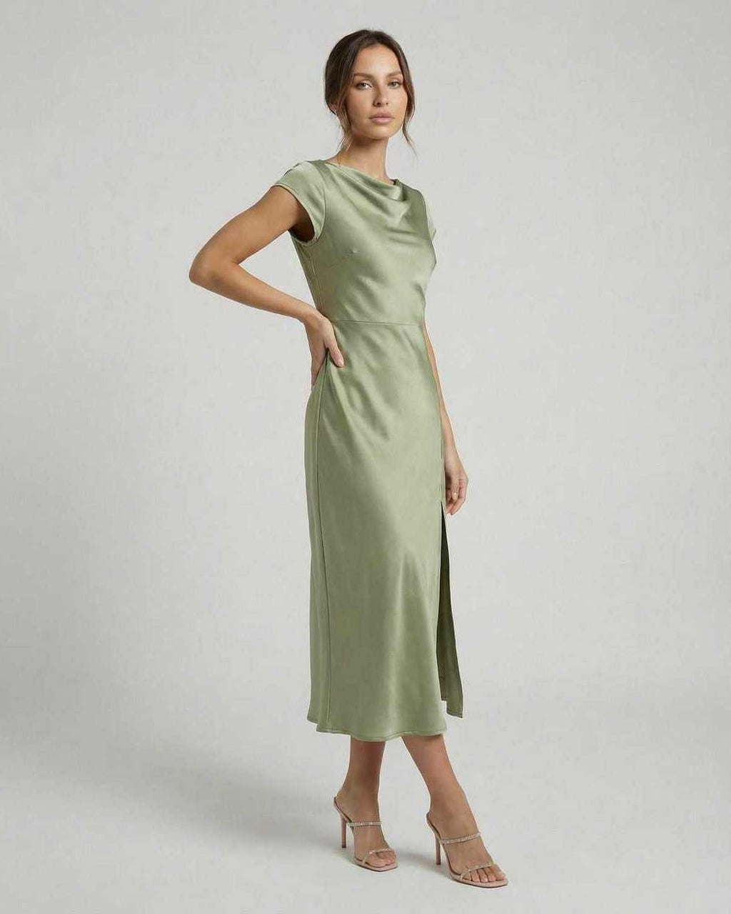 Virgo Midi Dress - Sleek satin dress with twisted-back, cutout detail, exuding elegance in soft sage green by Lauven.