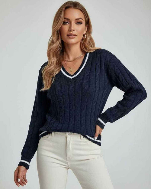 Monaco Sweater by Lauven showcased on a model, featuring a V-neck and cable knit design in deep navy.