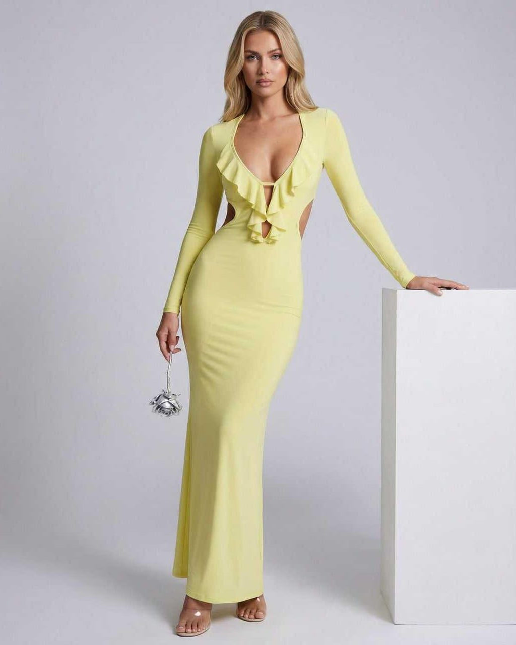 Zahara Maxi Dress in yellow with ruffle V-neck, open back, and bodycon fit by Lauven, showcasing elegance and style.