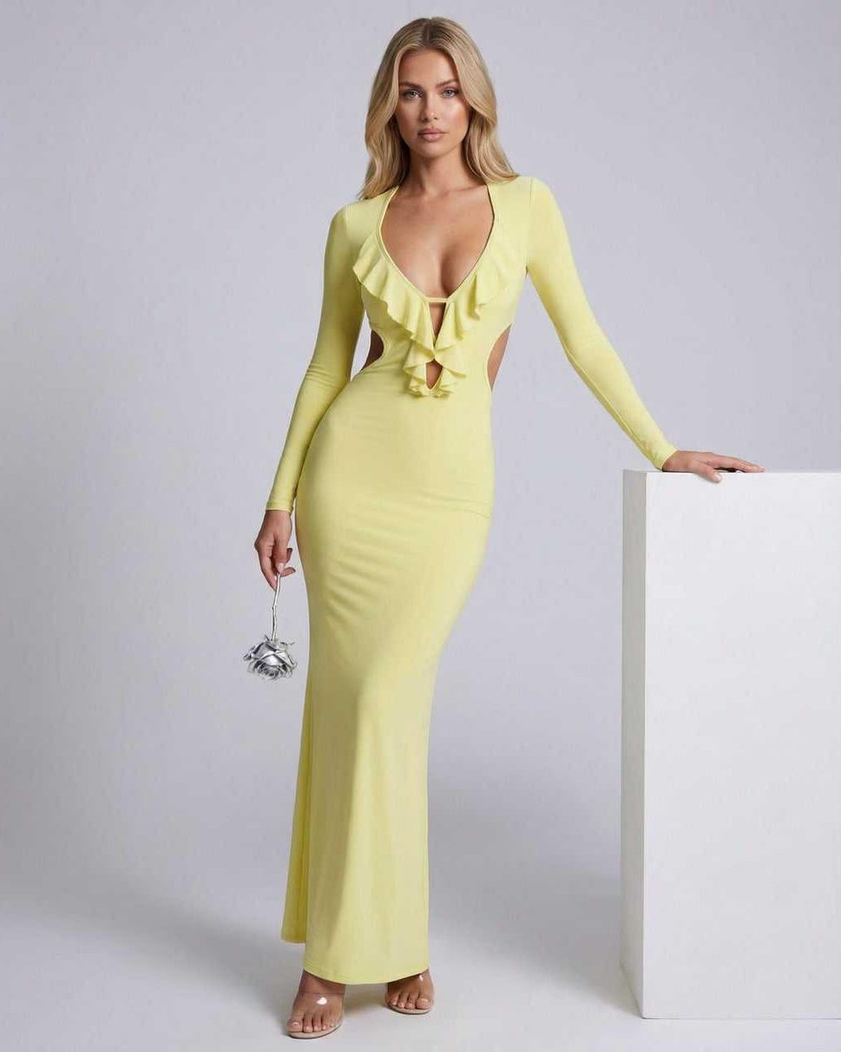 Zahara Maxi Dress in yellow with ruffle V-neck, open back, and bodycon fit by Lauven, showcasing elegance and style.