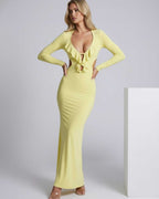 Zahara Maxi Dress in yellow featuring ruffle V-neck, open back design, smooth fit, and elegant feel by Lauven.