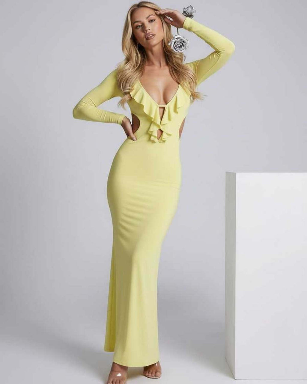 Zahara Maxi Dress in yellow featuring a plunging V-neck, ruffle detail, and open back for a chic, elegant look by Lauven.
