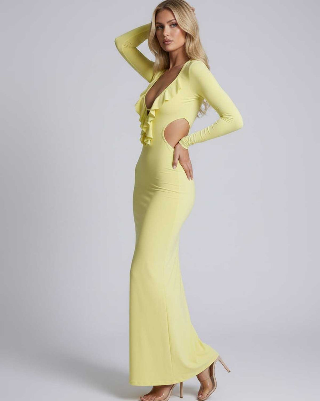 Zahara Maxi Dress featuring a plunging V-neck, ruffle details, open back, and sleek bodycon fit by Lauven.