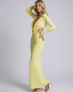 Zahara Maxi Dress featuring a plunging V-neck, ruffle details, open back, and sleek bodycon fit by Lauven.