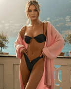 Zaria Bikini Set in black, featuring a balconette top with ring detail and paired with a pink cover-up by Lauven.