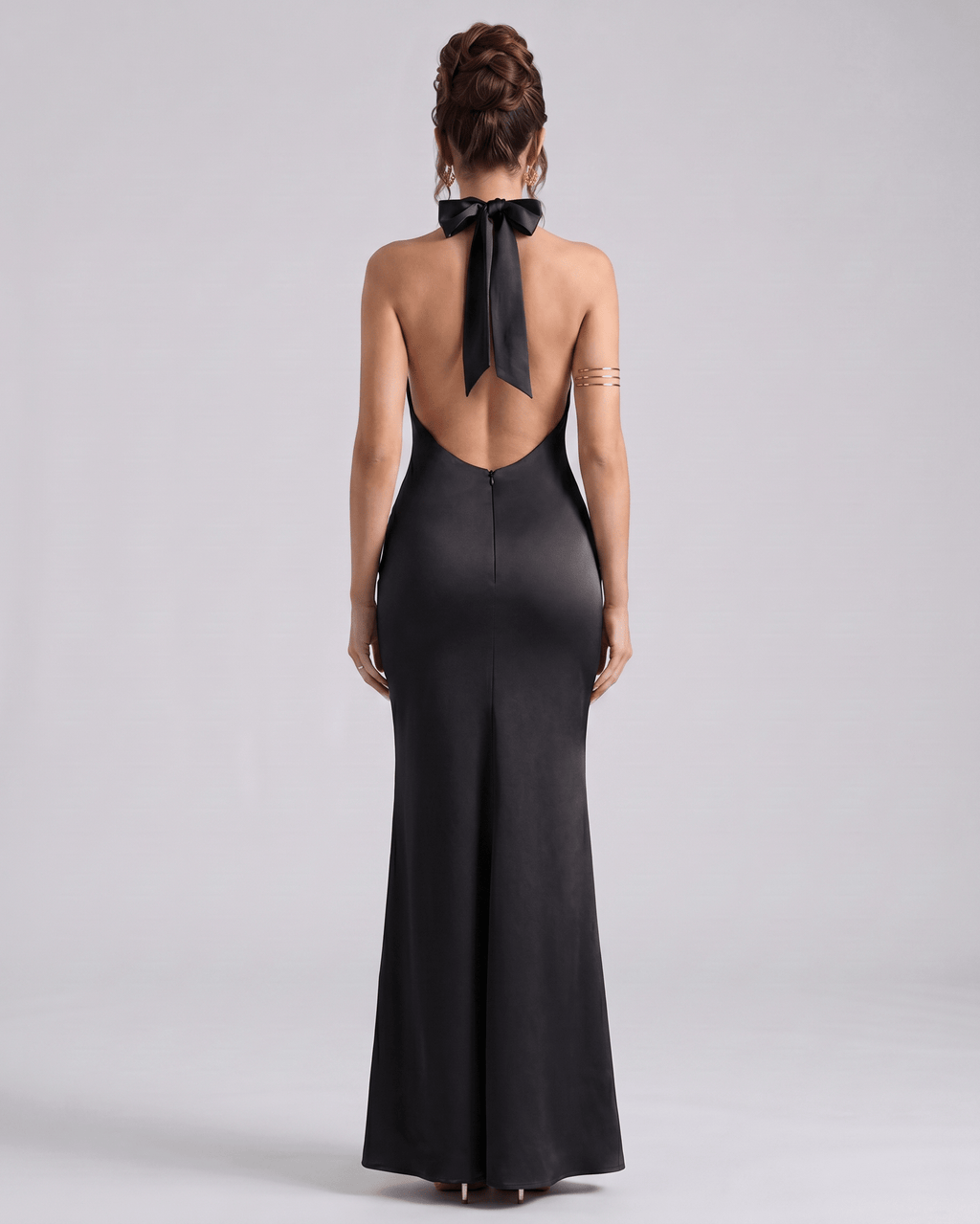 Zerelle Maxi Dress in black, featuring a smooth polyester fabric, halter neckline, and elegant ruffle details by Lauven.