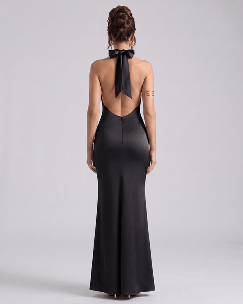 Zerelle Maxi Dress in black, featuring a smooth polyester fabric, halter neckline, and elegant ruffle details by Lauven.