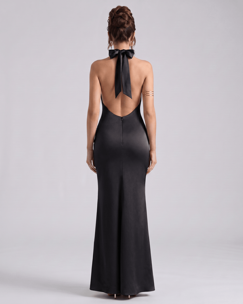 Zerelle Maxi Dress in black, featuring a smooth polyester fabric, halter neckline, and elegant ruffle details by Lauven.